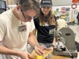 Alex and Zoe learning about leatherworking