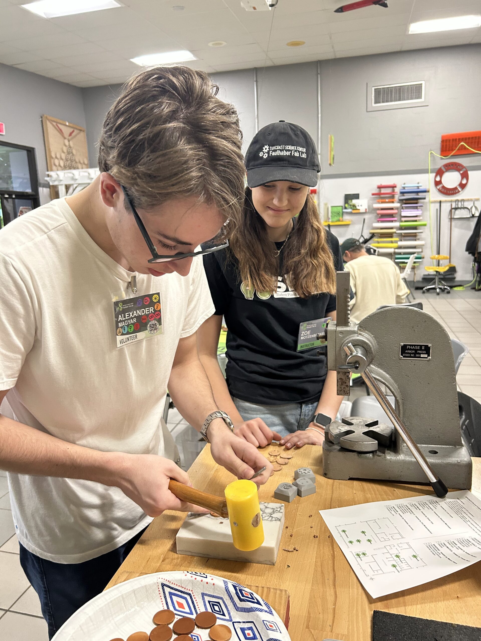 Alex and Zoe learning about leatherworking